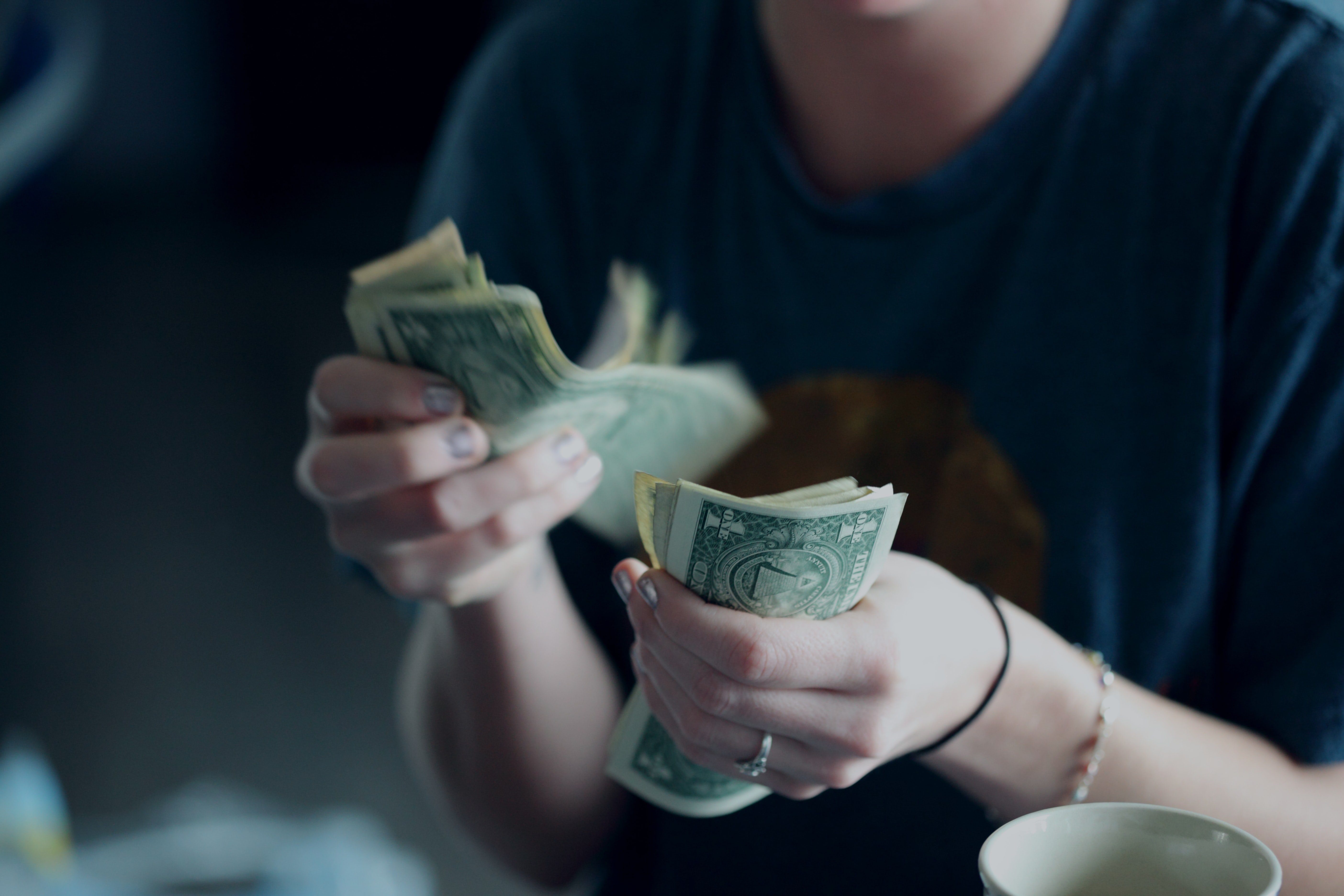 Image 2 counting money or doing up a budget